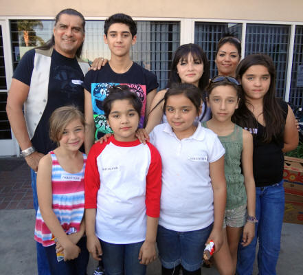 Actor Jonathan Joss with Rebecca and her seven children at California Outreach Organization